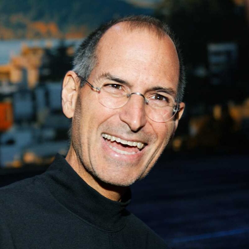 Steve Jobs laughing.